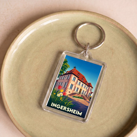 Porte-clés souvenir de la ville de Ingersheim avec une illustration stylisée d'une demeure historique fleurie.