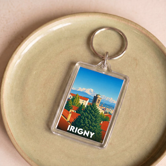 Porte-clés souvenir de la ville d'Irigny avec une illustration stylisée.