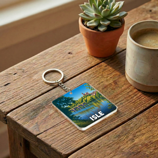 Porte-clés souvenir de la ville de Isle avec une illustration stylisée d'un pont et de la rivière.