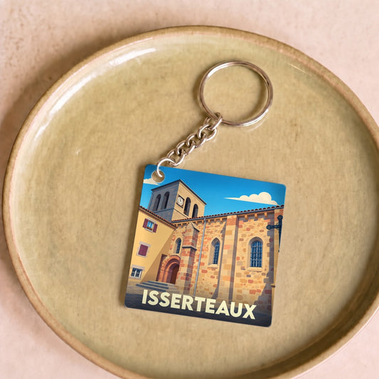 Porte-clés souvenir de la ville d'Isserteaux avec une illustration stylisée de son église.