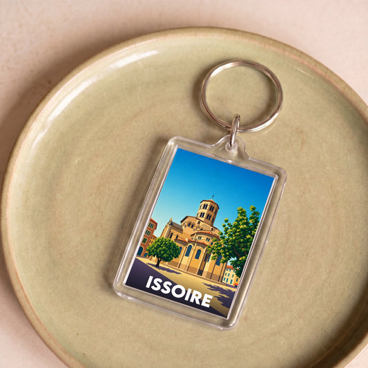 Porte-clés souvenir de la ville d'Issoire avec une illustration graphique stylisée.