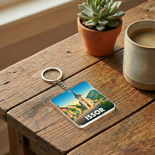 Porte-clés souvenir de la ville d'Issor avec une illustration stylisée.
