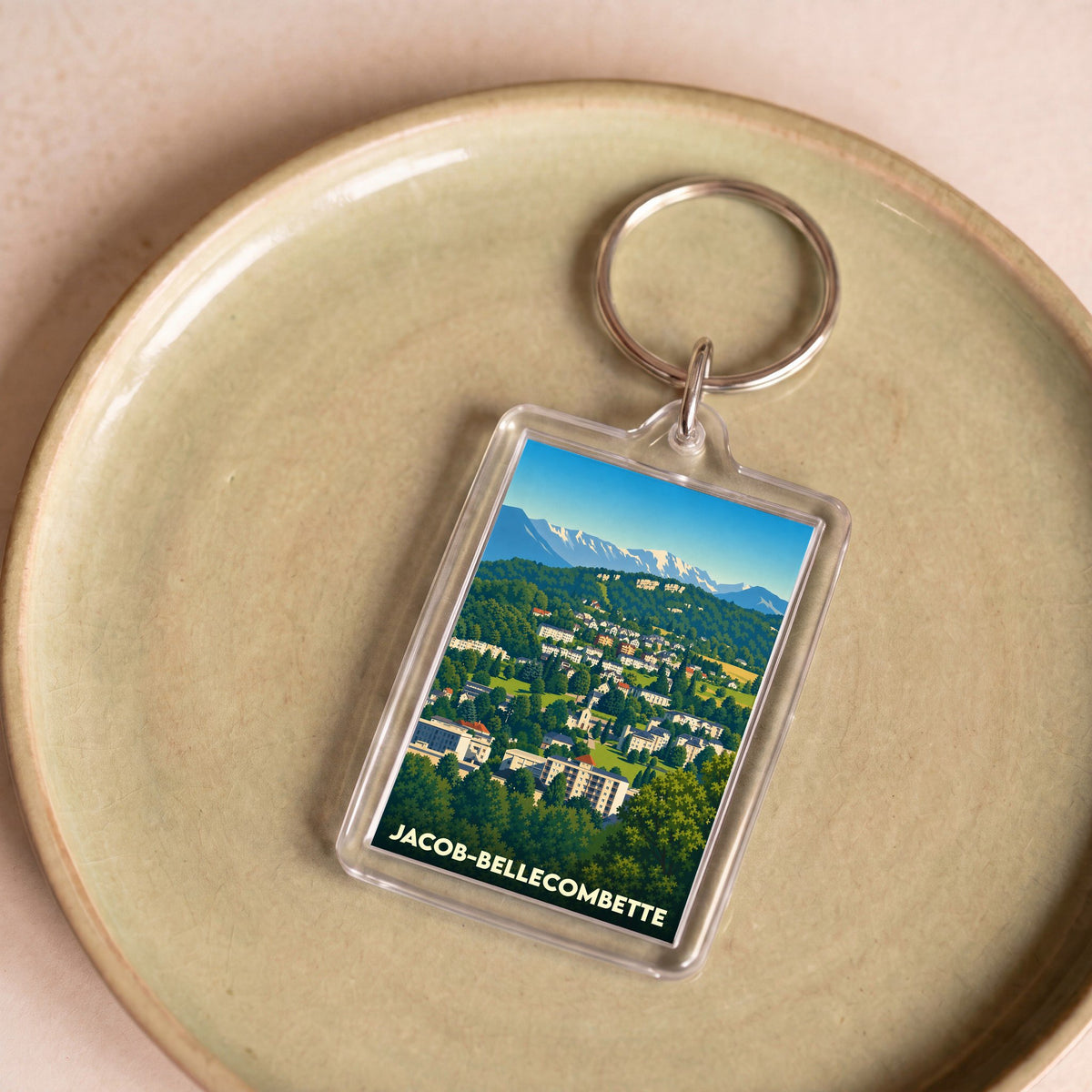 Porte-clés souvenir de la ville de Jacob-Bellecombette avec une illustration stylisée.