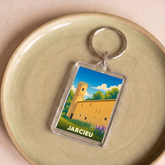 Porte-clés souvenir de la ville de Jarcieu avec une illustration stylisée de son patrimoine.