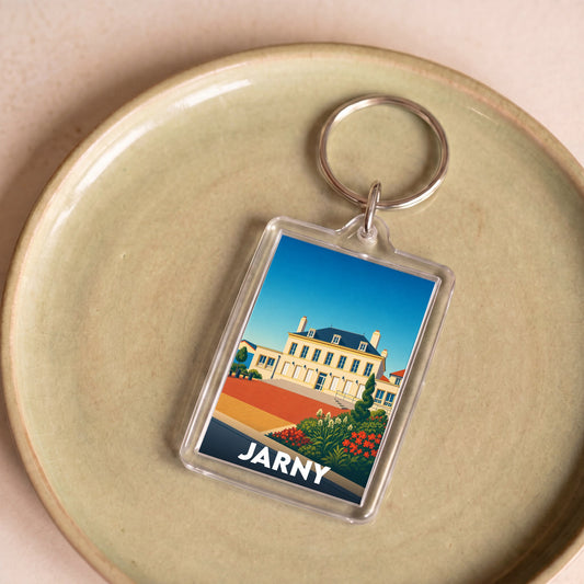 Porte-clés souvenir de la ville de Jarny avec une illustration stylisée.