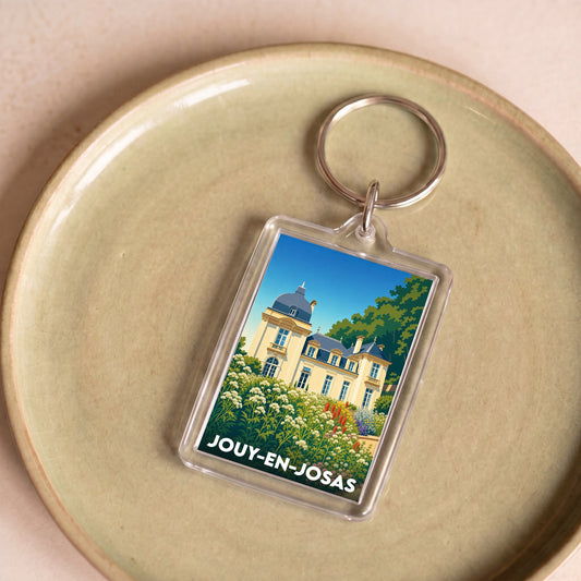 Porte-clés souvenir de la ville de Jouy-en-Josas avec une illustration stylisée de son patrimoine.
