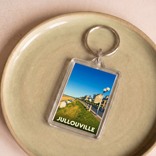 Porte-clés souvenir de la ville de Jullouville avec une illustration stylisée de son front de mer.