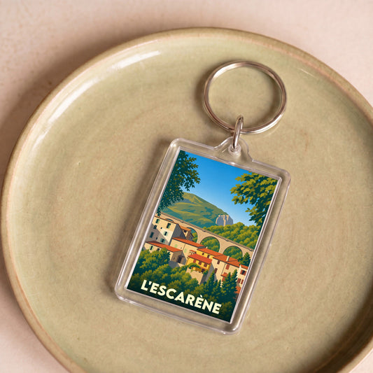 Porte-clés souvenir de la ville de L'Escarène avec une illustration stylisée.