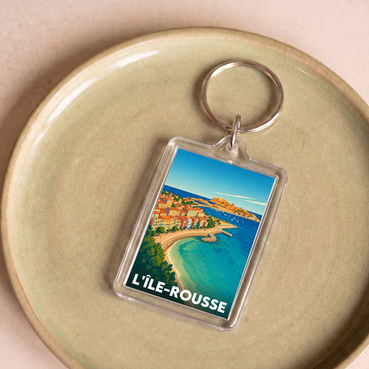 Porte-clés souvenir de la ville de L'Île-Rousse avec une illustration stylisée.