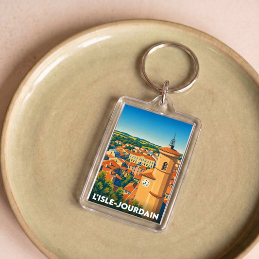 Porte-clés souvenir de la ville de L'Isle-Jourdain avec une illustration stylisée.