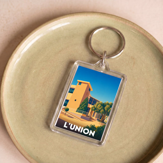 Porte-clés souvenir de la ville de L'Union avec une illustration stylisée.