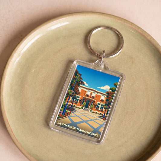 Porte-clés souvenir de la ville de La Chapelle-d'Armentières avec une illustration stylisée de l'hôtel de ville.