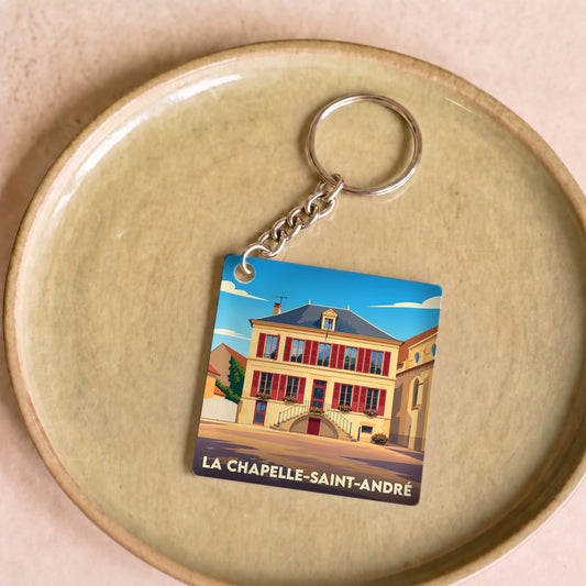 Porte-clés souvenir de la ville de La Chapelle-Saint-André avec une illustration stylisée d'un bâtiment historique.