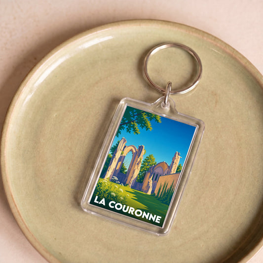 Porte-clés souvenir de la ville de La Couronne avec une illustration stylisée des ruines de son abbaye.