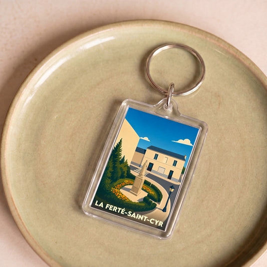 Porte-clés souvenir de la ville de La Ferté-Saint-Cyr avec une illustration stylisée.