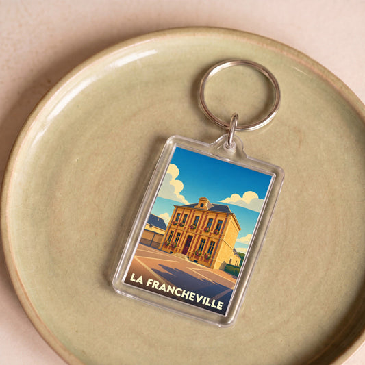 Porte-clés souvenir de la ville de La Francheville avec une illustration stylisée.