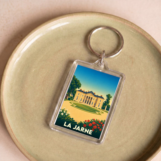 Porte-clés souvenir de la ville de La Jarne avec une illustration stylisée d'un château.
