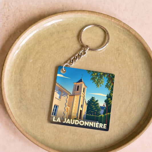 Porte-clés souvenir de la ville de La Jaudonnière avec une illustration stylisée.