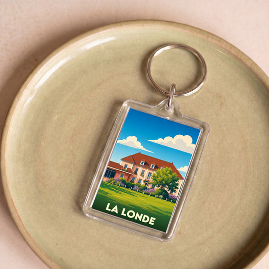 Porte-clés souvenir de la ville de La Londe avec une illustration stylisée.