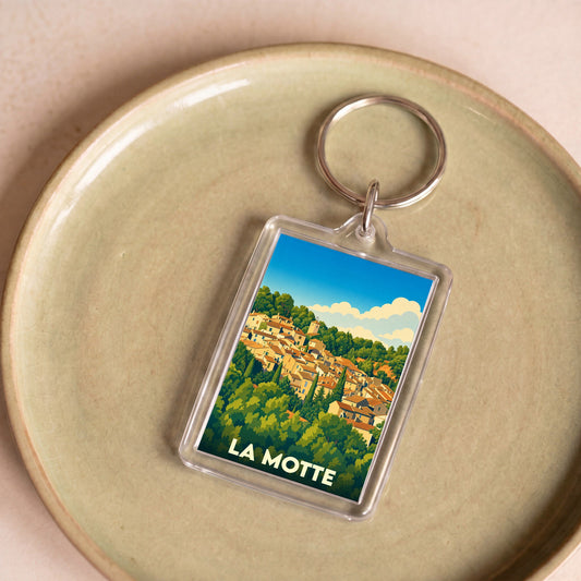 Porte-clés souvenir de la ville de La Motte avec une illustration stylisée.