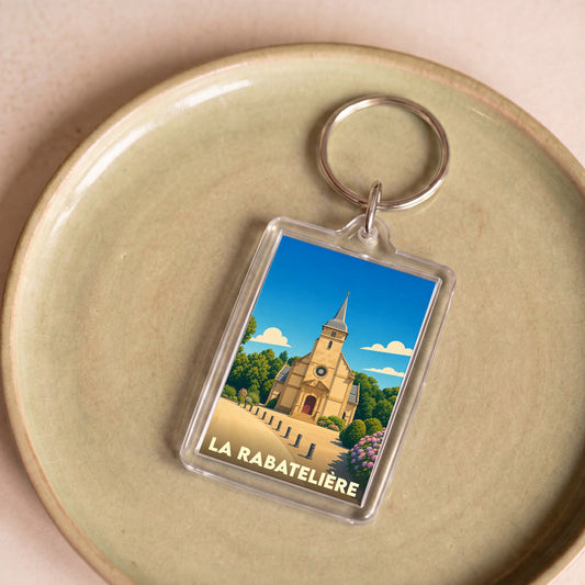 Porte-clés souvenir de la ville de La Rabatelière avec une illustration stylisée de son église.
