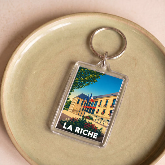 Porte-clés souvenir de la ville de La Riche avec une illustration stylisée.