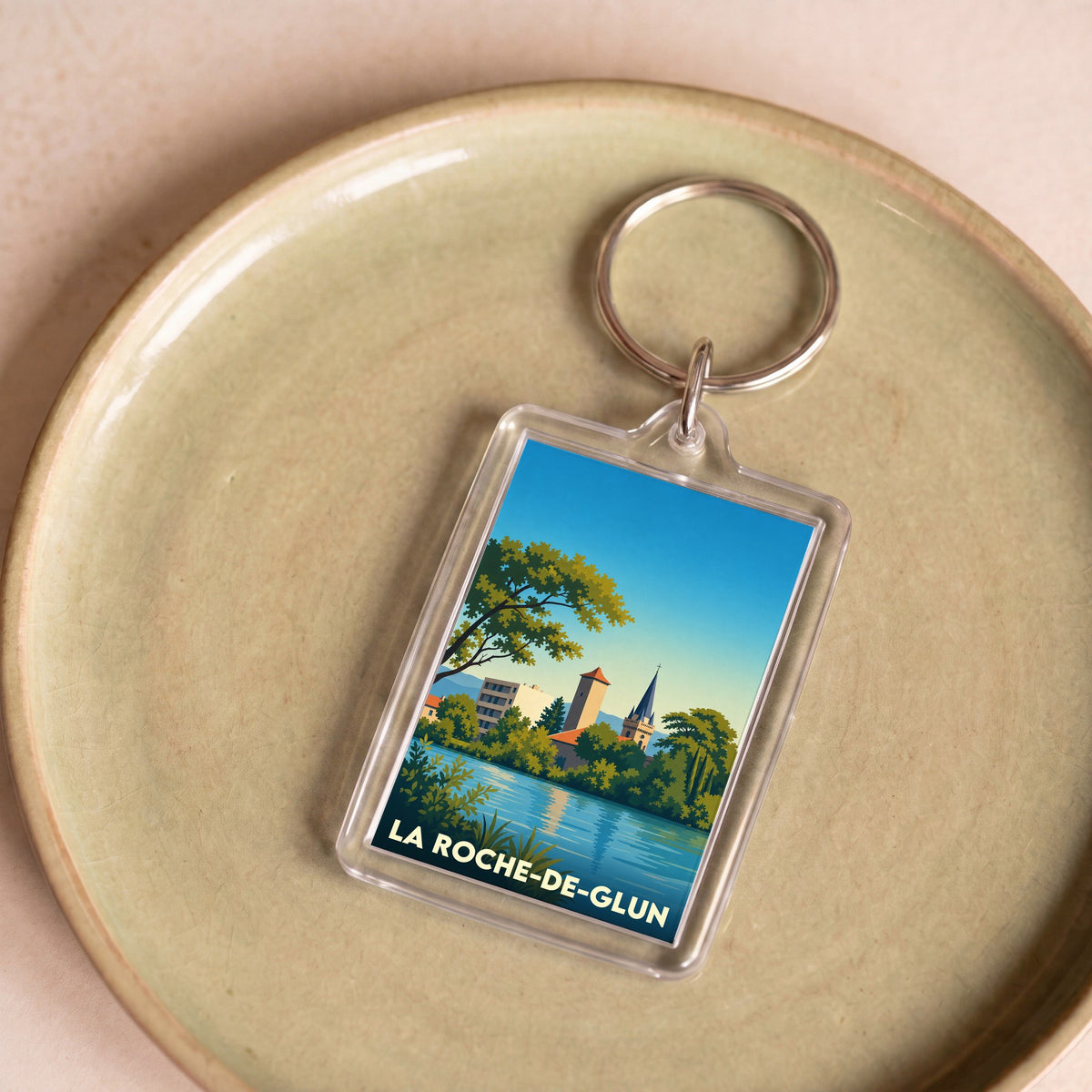 Porte-clés souvenir de la ville de La Roche-de-Glun avec une illustration stylisée.