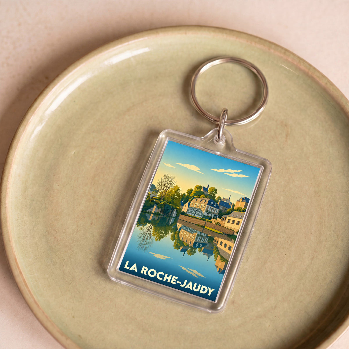 Porte-clés souvenir de la ville de La Roche-Jaudy avec une illustration stylisée.