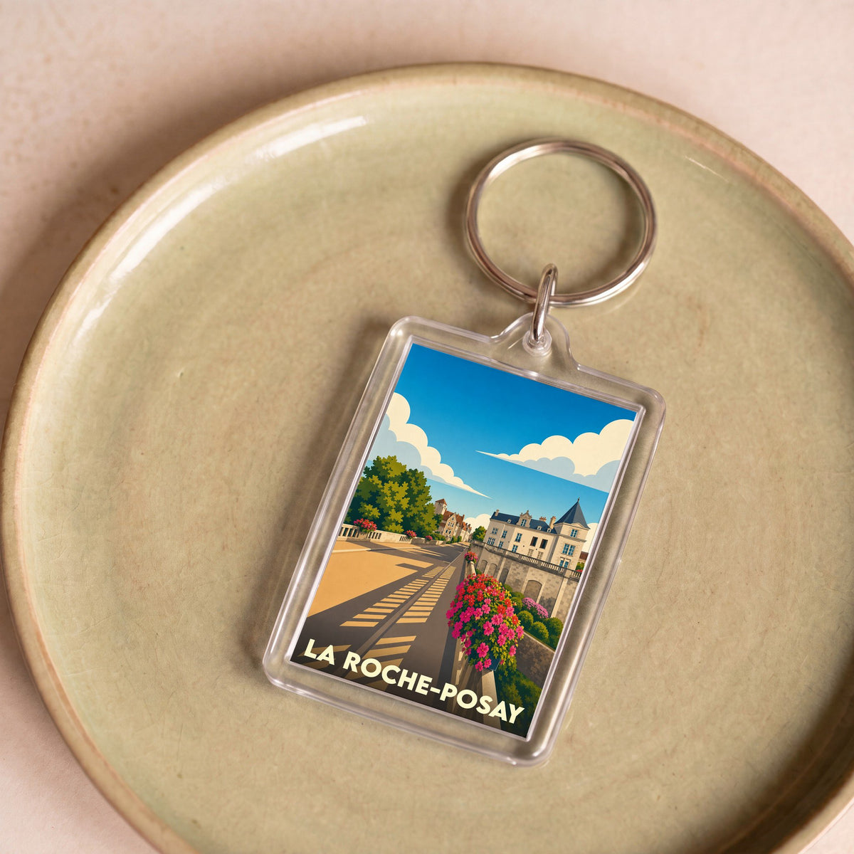 Porte-clés souvenir de la ville de La Roche-Posay avec une illustration stylisée.