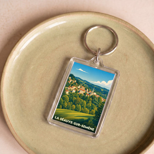 Porte-clés souvenir de la ville de La Séauve-sur-Semène avec une illustration stylisée.