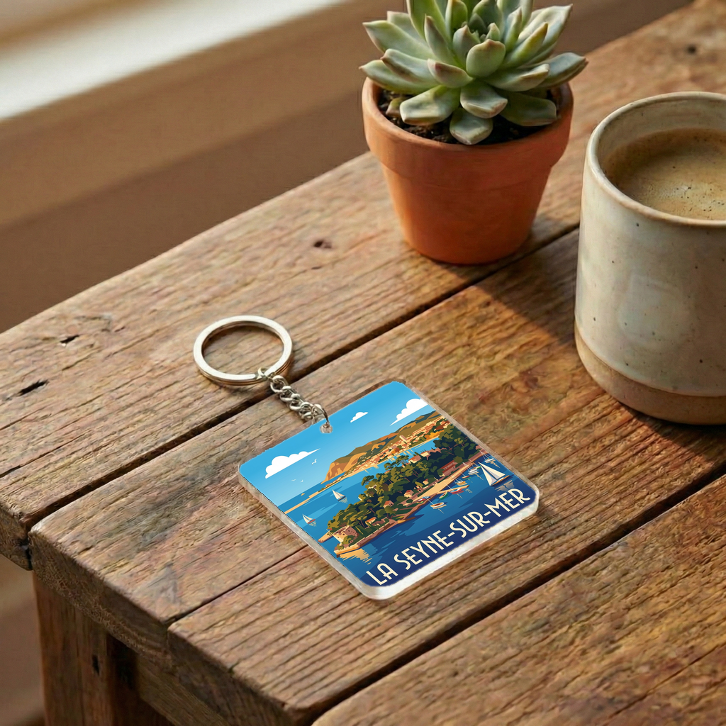 Porte-clés souvenir de la ville de La Seyne-sur-Mer avec une illustration stylisée.