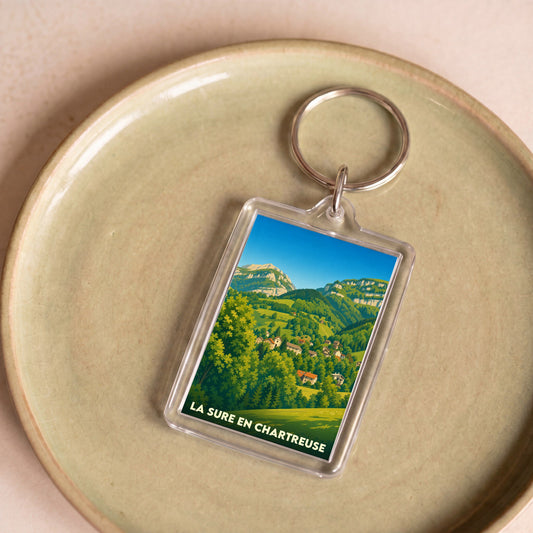 Porte-clés souvenir de La Sure en Chartreuse avec une illustration stylisée de ses paysages montagneux.