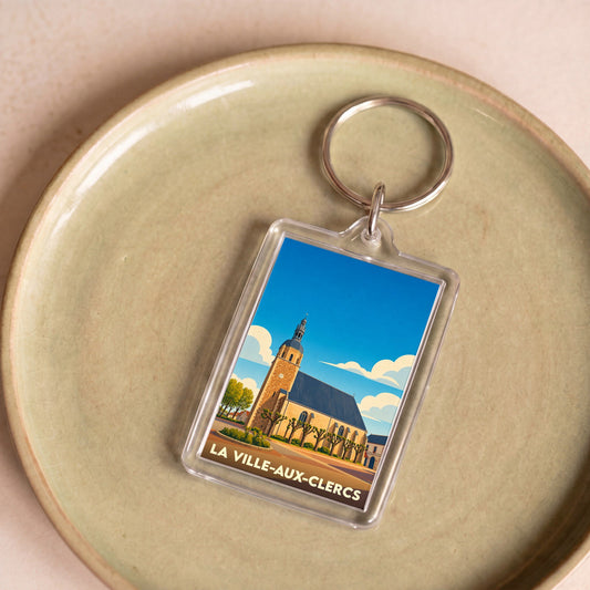 Porte-clés souvenir de La Ville-aux-Clercs avec une illustration stylisée de son église.