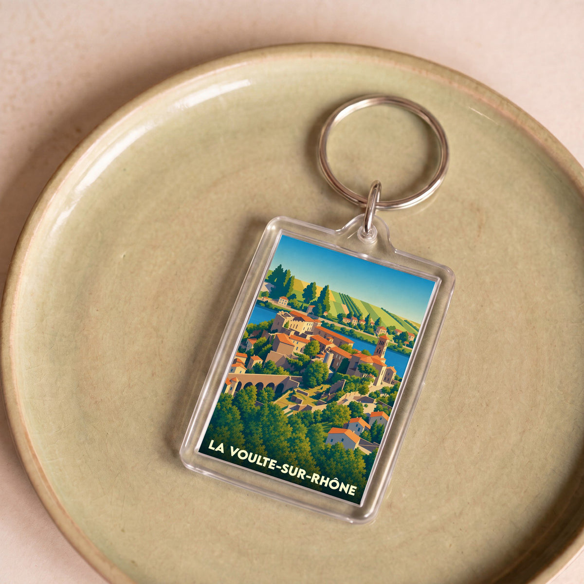 Porte-clés souvenir de la ville de La Voulte-sur-Rhône avec une illustration stylisée.