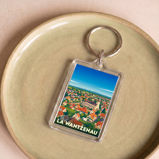 Porte-clés souvenir de la ville de La Wantzenau avec une illustration stylisée.