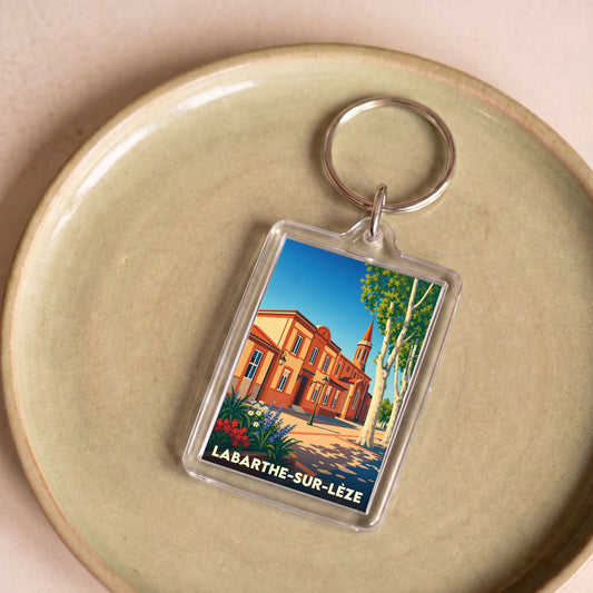 Porte-clés souvenir de la ville de Labarthe-sur-Lèze avec une illustration stylisée.