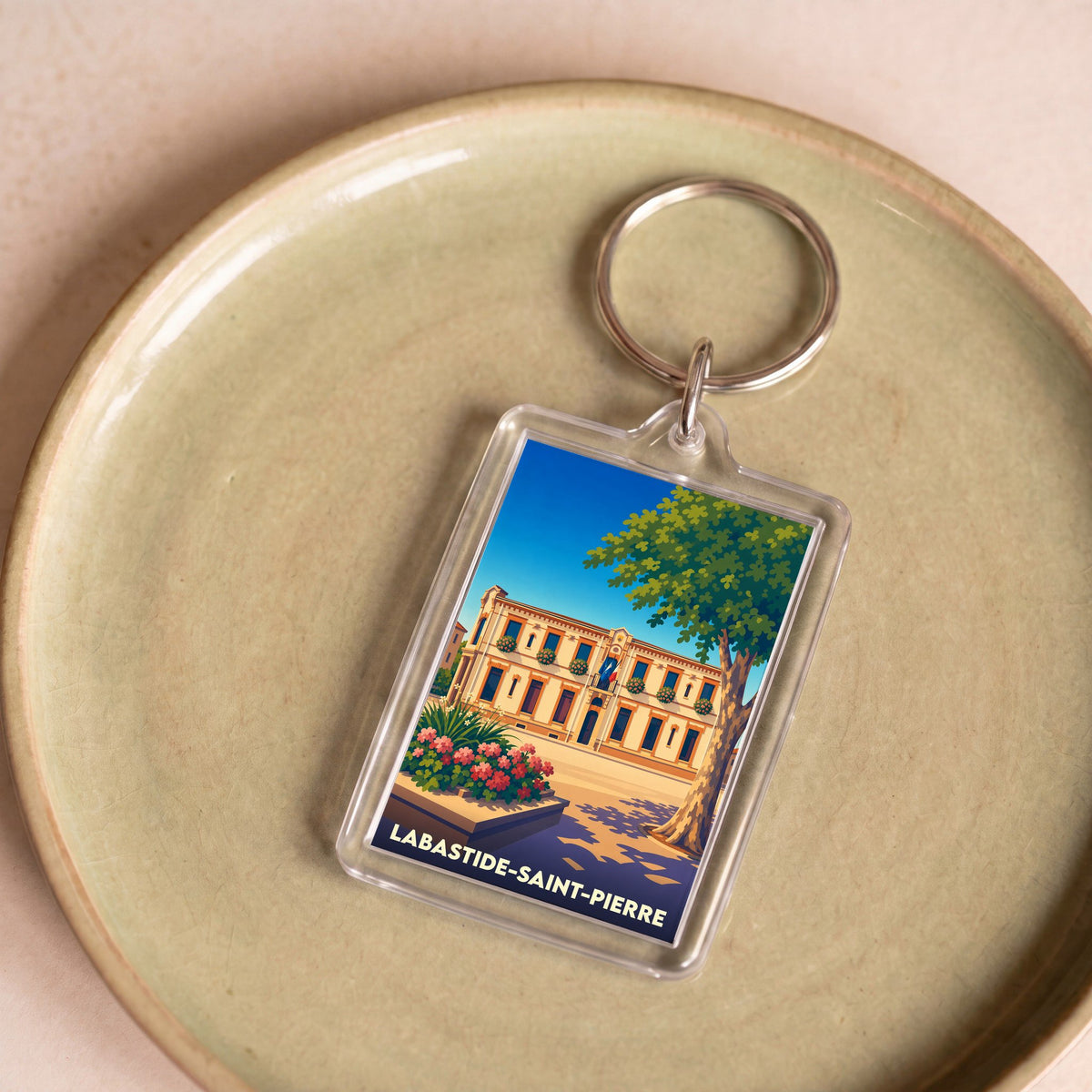 Porte-clés souvenir de la ville de Labastide-Saint-Pierre avec une illustration stylisée.