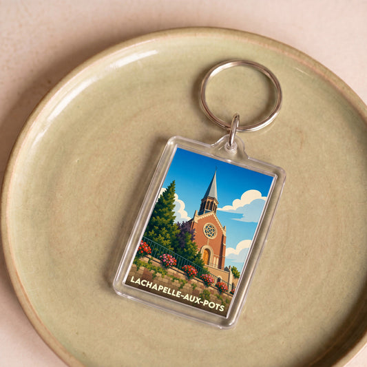 Porte-clés souvenir de la ville de Lachapelle-aux-Pots avec une illustration stylisée de son église.