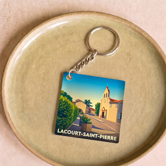 Porte-clés souvenir de la ville de Lacourt-Saint-Pierre avec une illustration stylisée.