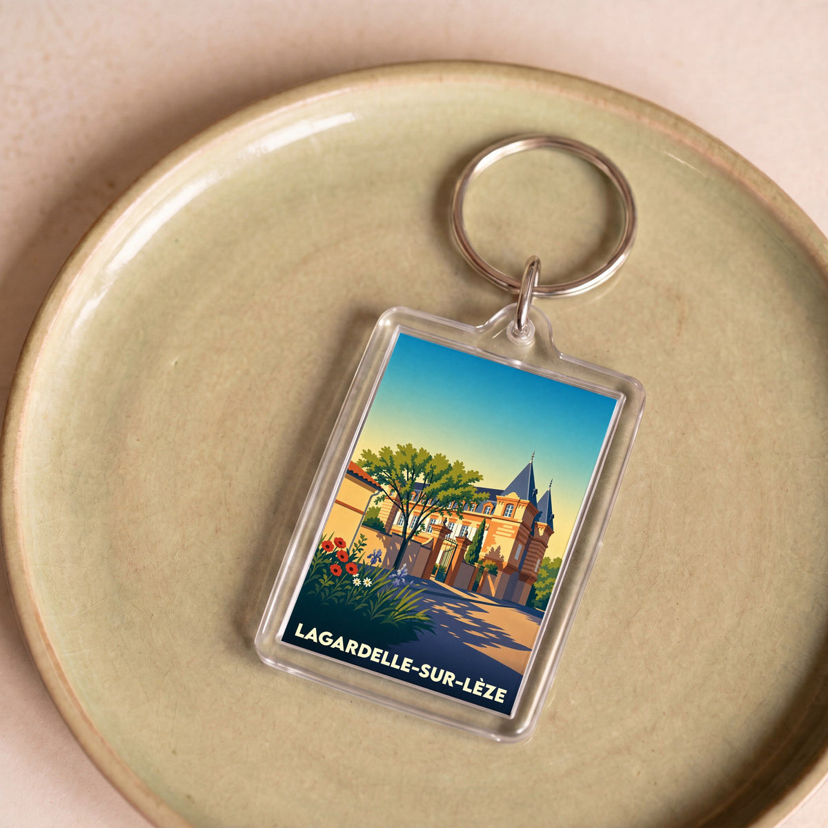 Porte-clés souvenir de la ville de Lagardelle-sur-Lèze avec une illustration stylisée.