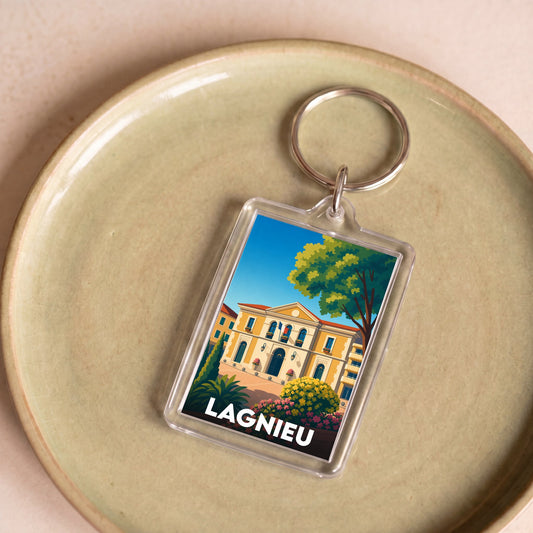 Porte-clés souvenir de la ville de Lagnieu avec une illustration stylisée.
