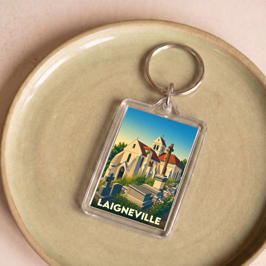 Porte-clés souvenir de la ville de Laigneville avec une illustration stylisée de son église et de son cimetière.