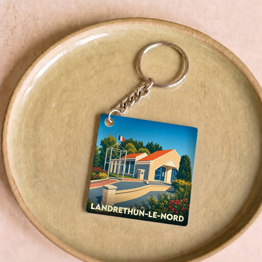 Porte-clés souvenir de la ville de Landrethun-le-Nord avec une illustration stylisée.