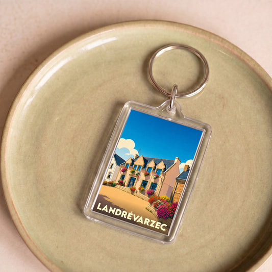 Porte-clés souvenir de la ville de Landrévarzec avec une illustration stylisée.
