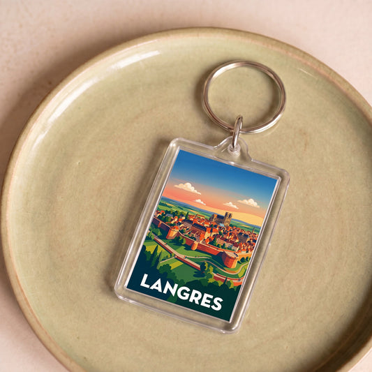 Porte-clés souvenir de la ville de Langres avec une illustration colorée et stylisée.