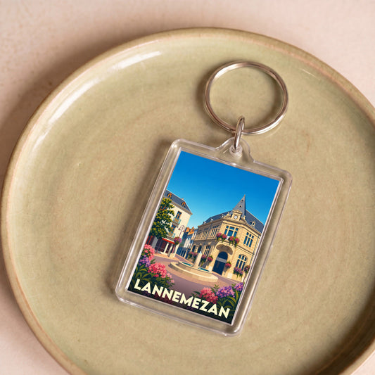 Porte-clés souvenir de la ville de Lannemezan avec une illustration stylisée.