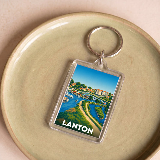 Porte-clés souvenir de la ville de Lanton avec une illustration stylisée du bassin.