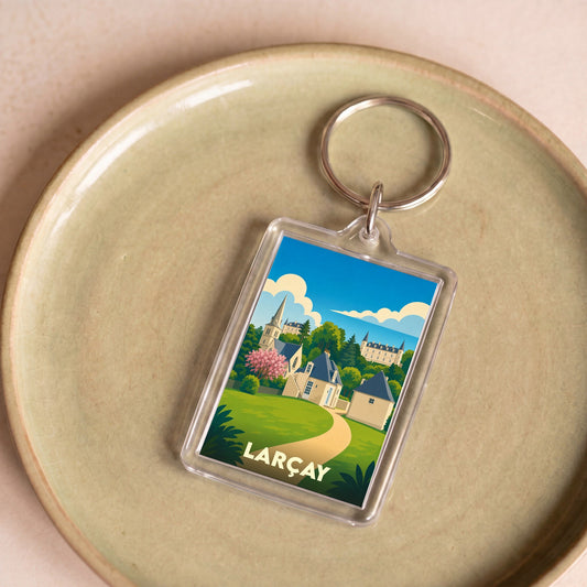 Porte-clés souvenir de la ville de Larçay avec une illustration stylisée de son paysage.