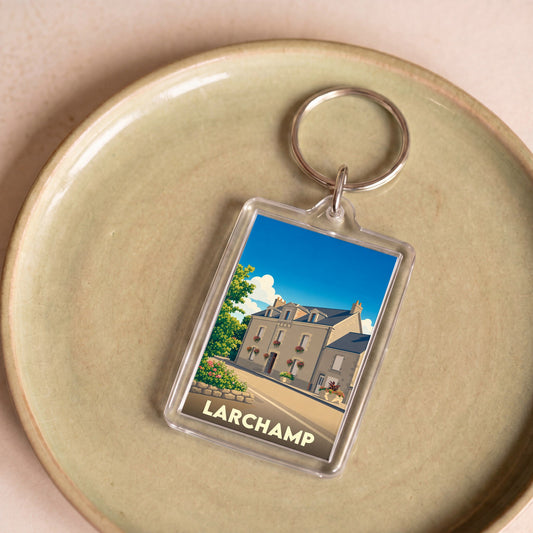 Porte-clés souvenir de la ville de Larchamp avec une illustration stylisée.