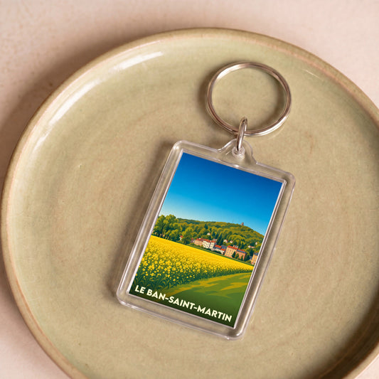 Porte-clés souvenir de la ville du Ban-Saint-Martin avec une illustration stylisée d'un champ fleuri.